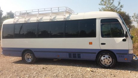 Rent a Saloon Coaster low rent , Hiace Vans for Marriage and Tour 